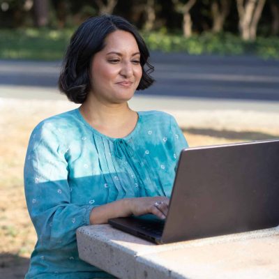 picture of seema shah the dietitian, sitting on her computer